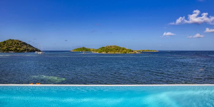 Location villa Saint Martin Baie Cul de Sac - villa 6 chambres 14 personnes - piscine - vue mer - bord de mer - face Ilet Pinel
