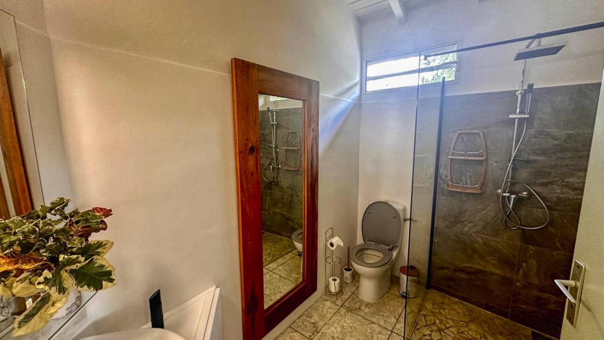 Rental Guadeloupe - villa corossol - saloon and kitchen