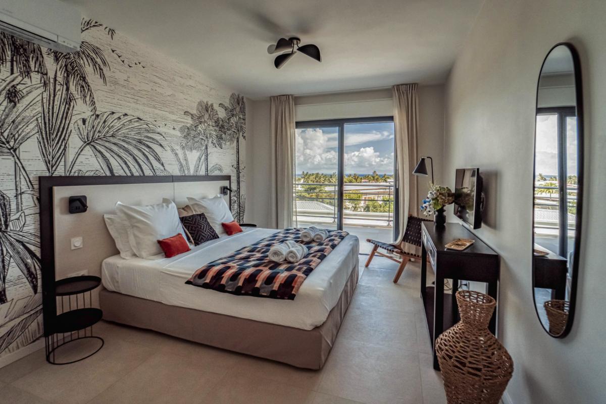 Location villa piscine vue mer 9 chambres Sainte Anne Guadeloupe_Chambre 7