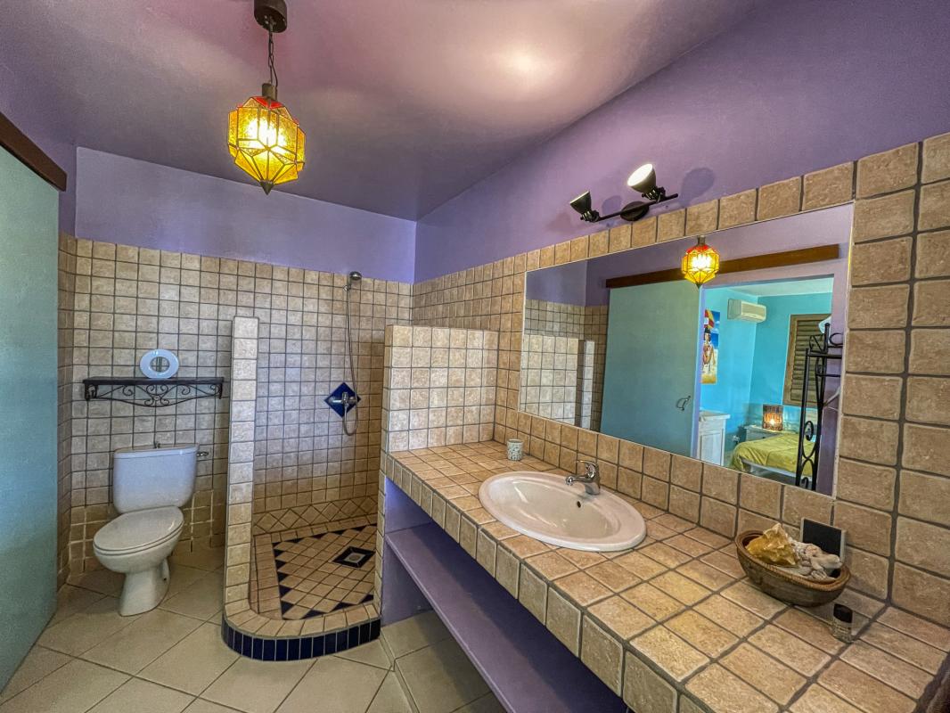 Location villa tropicale 5 chambres 10 personnes avec piscine et vue mer Saint François en Guadeloupe - sdd