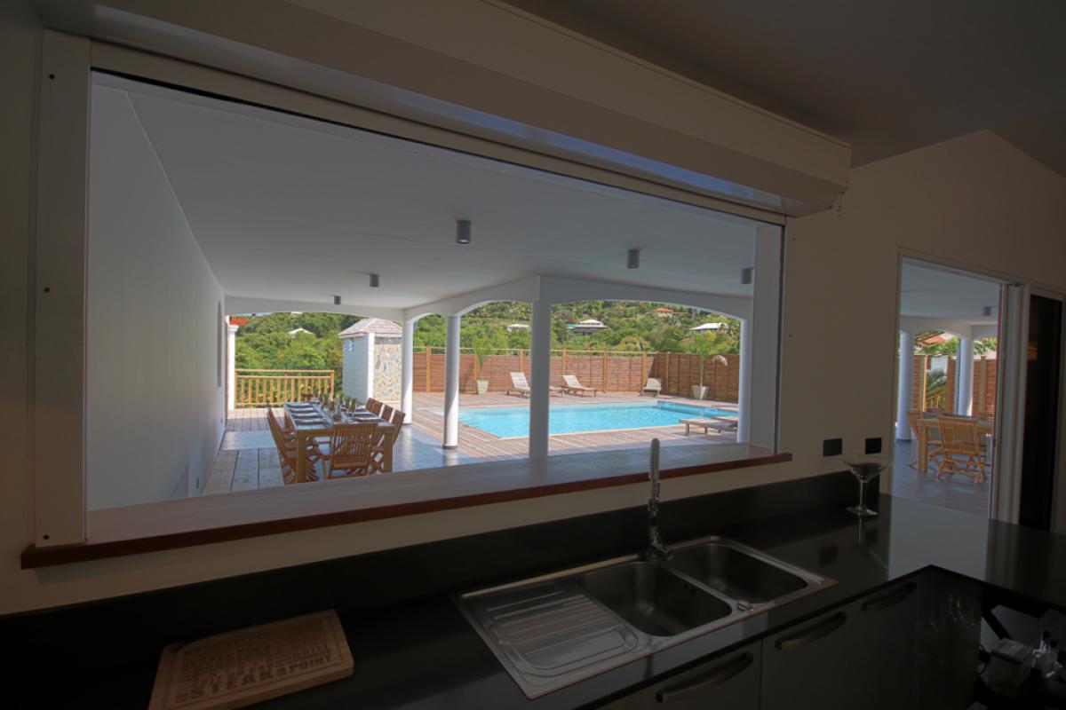 Kitchen view on swimming pool