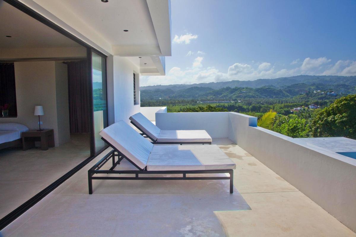 Location villa Las Terrenas - La terrasse de la suite de 80m² du niveau supérieur